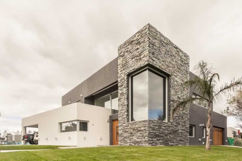 luxury mansion with stone accents 