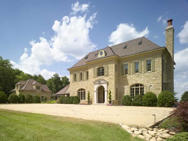 luxury mansion with stone accents 