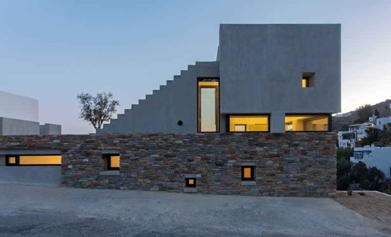 luxury mansion with stone accents 